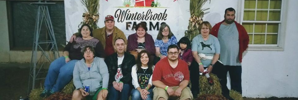 group photo at Winterbrook Farm. From left to right top row, Roz, Mark, Angie, Natalie, Paige, Jane, Alex. Left to Right bottom row Misst, Michael, Katie and Zack