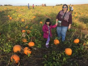 In the pumpkin patch towards the right is Paige and Roz 